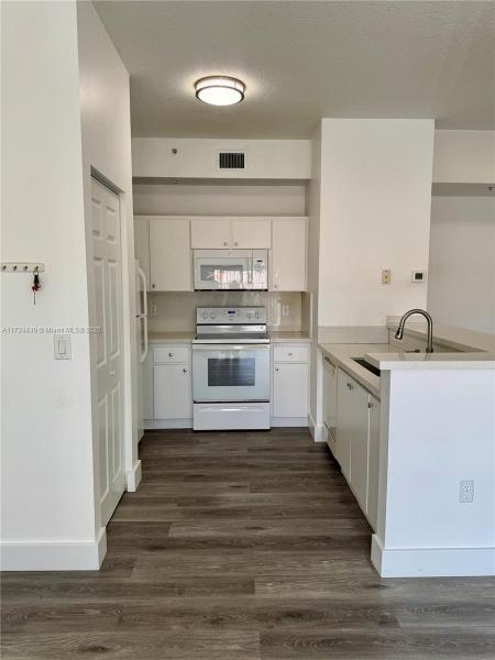 PALM GARDENS AT DORAL CON