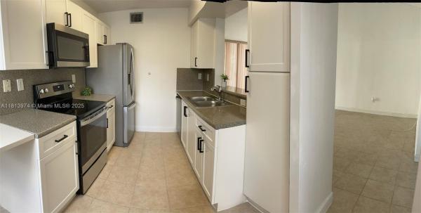 THE GREENS AT DORAL CONDO