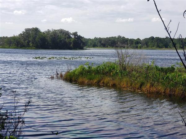 COUNTRY WOODS LAKEFRONT HOMESITES UNREC