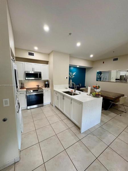 PALM GARDENS AT DORAL CON