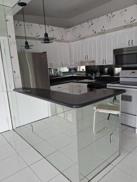 TAMARAC GARDENS CONDOMINI